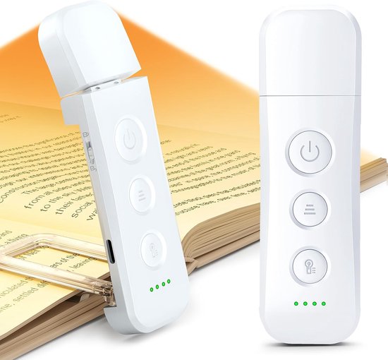 Witte draagbare leeslamp met drie ronde bedieningsknoppen en groene batterijstatuslampjes op een boek.