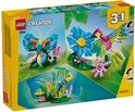 Boîte LEGO Creator 3 en 1 montrant un colibri, un papillon et un poisson dans des designs colorés.