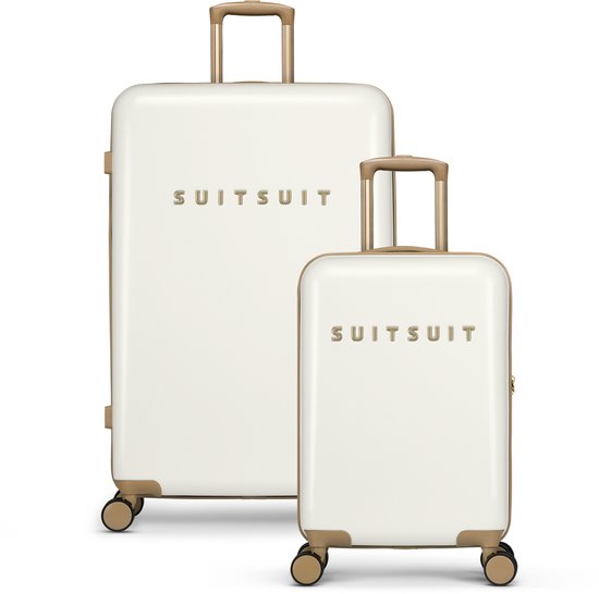 Twee witte koffers, een grote en een handbagage koffer, met gouden details.