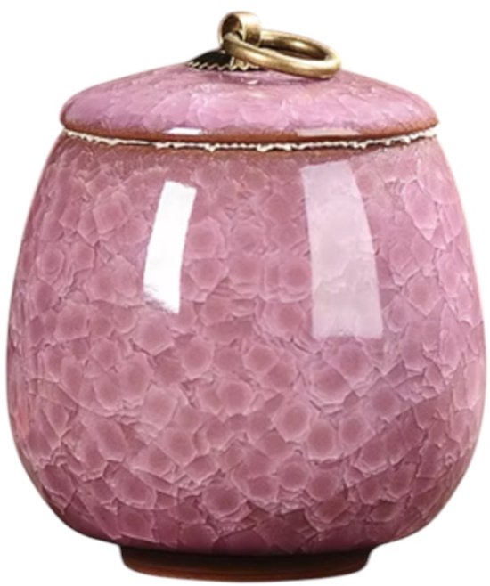 Roze keramieken mini urn met een deksel, gouden ring en mozaïekpatroon.