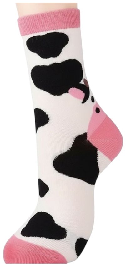 Witte sok met zwarte koeienvlekken en een roze koe. Roze boord.