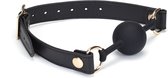 Dark Secret Exclusieve Siliconen ball gag met lederen riempjes - zwart/goud