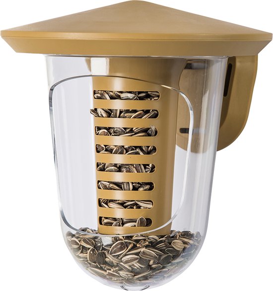 Bruine vogelvoederdispenser gevuld met zonnebloempitten.