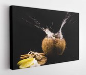 Canvas schilderij - Coconut, water splashes, lemon, black background, exotic  -     1030081540 - 115*75 Horizontal