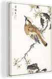Gros plan détaillé du côté d'une toile représentant une estampe japonaise d'un oiseau sur une branche.