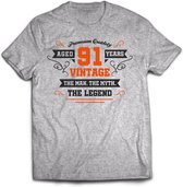 91 Jaar Legend - Feest kado T-Shirt Heren / Dames - Antraciet Grijs / Oranje - Perfect Verjaardag Cadeau Shirt - grappige Spreuken, Zinnen en Teksten. Maat M