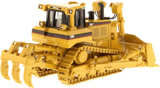 Gele Caterpillar D8R bulldozer met grijper aan de voorzijde en schuifblad.