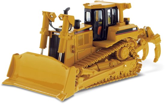 Gele Caterpillar D8R bulldozer met grijper en schuifblad.