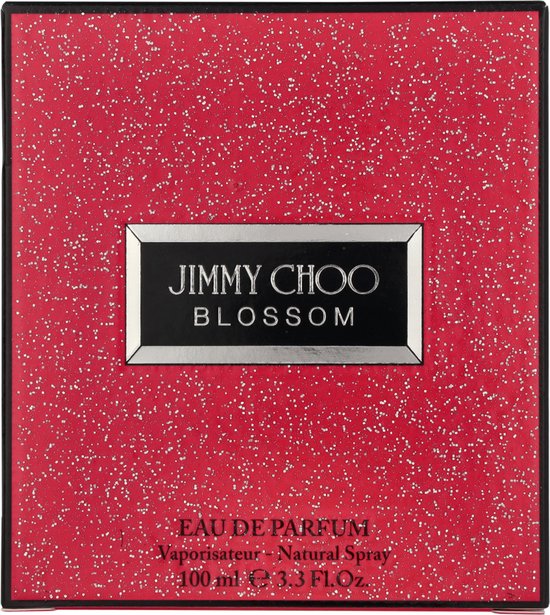 Rode doos Jimmy Choo Blossom met witte spikkels, tekst 'EAU DE PARFUM'.