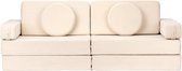 Beige ribstof speelbank, twee zitplaatsen met ronde kussens en armleuningen.
