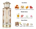 Parfumfles Teriaq Lattafa met oranje vloeistof, witte accenten en gouden slang-dop, naast geur-ingrediënten.