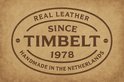 Logo van Timbelt: 'Real Leather Since 1978, Handmade in the Netherlands'.