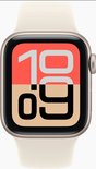 Gouden Apple Watch SE met een crèmekleurige band, wijzerplaat toont 10:09.