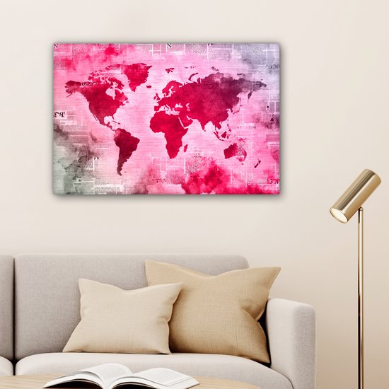 Wereldkaart avec peinture rose vif sur fond avec journal 90x60 cm