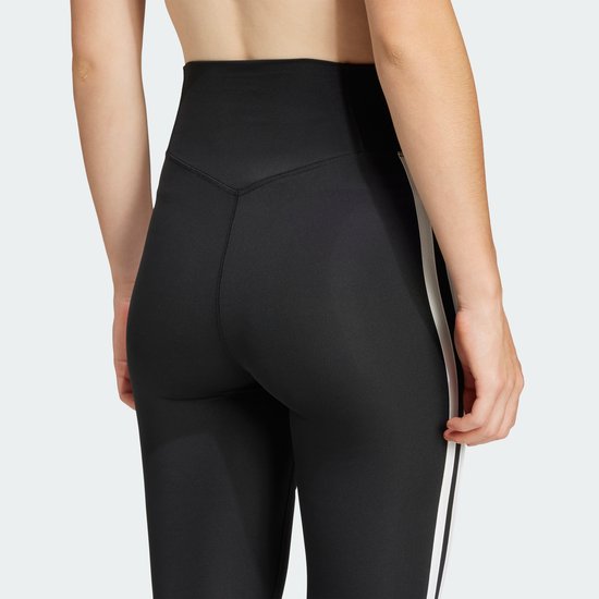 Zwarte sportlegging met witte strepen op het been en een hoge taille.
