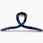 Blauwe Moonie's haarklem met gouden details en marmerlook, met het "MOONIES" logo.