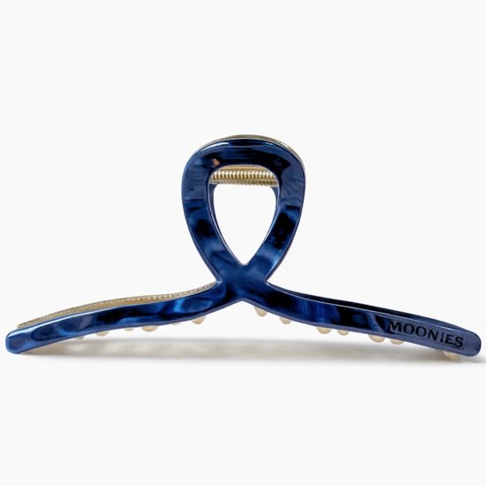 Blauwe Moonie's haarklem met gouden details en marmerlook, met het "MOONIES" logo.