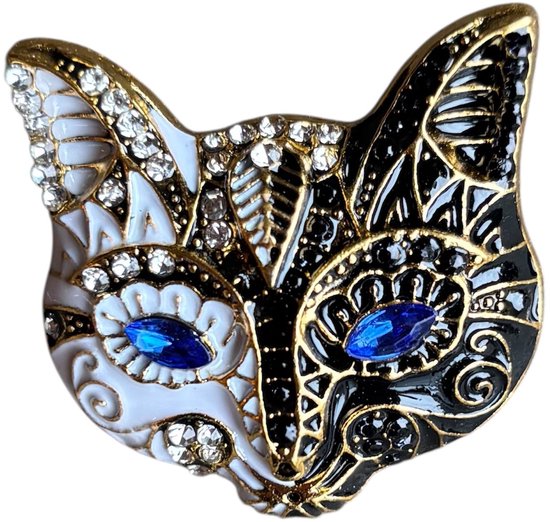 Gouden broche met kattengezicht, witte en zwarte emaille, blauwe strass-ogen en witte strass-versieringen.