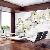 Fotobehangkoning - Behang - Vliesbehang - Fotobehang - The Urban Orchid - Orchidee - Witte Stenen - 100 x 70 cm