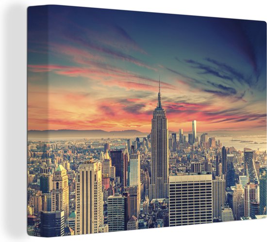 Canvas Schilderij Kleurrijke lucht boven het Empire State Building in New York - 120x90 cm - Wanddecoratie