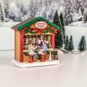 Een kersttafereel van een café met de tekst 'Christmas Spirits Cafe' en een menu.