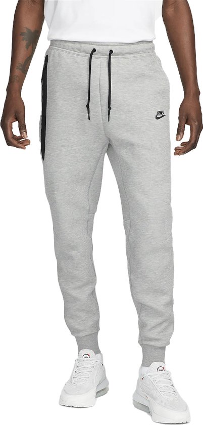 Pantalon de survêtement en molleton technique Nike gris.