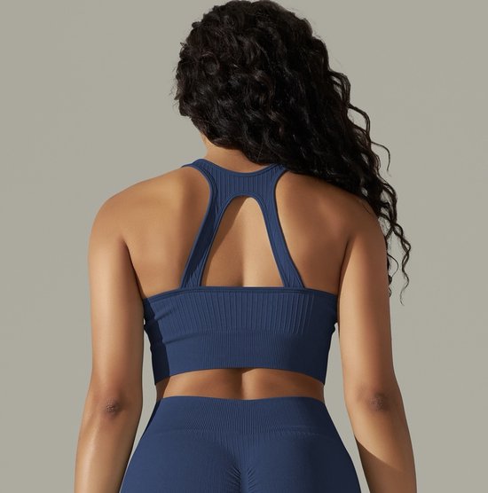 Blauwe sportbeha met ribbelstructuur en open rugdetail.