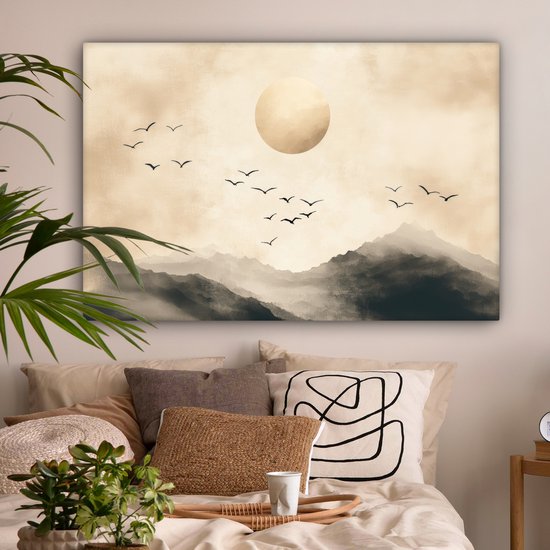 Toile paysage abstrait avec montagnes, grand cercle doré et oiseaux en vol, au-dessus d'un lit de chambre.