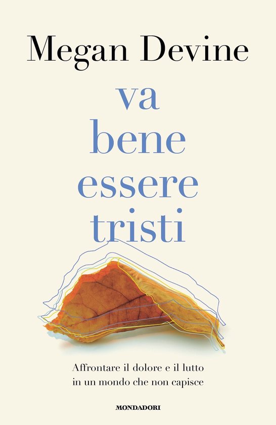 Boek "Va bene essere tristi" van Megan Devine, met een herfstblad in gele en blauwe lijnen.