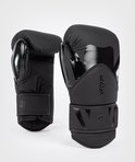 Zwarte VENUM boksring met glanzende V-opdruk en 16oz aanduiding.