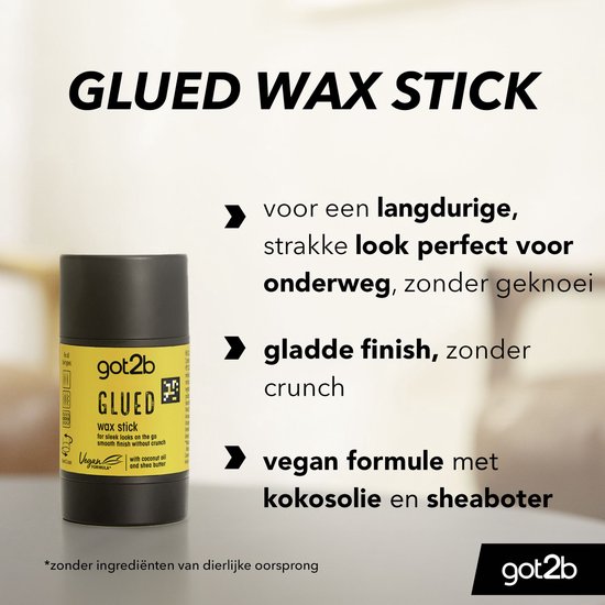 Zwarte tube met gele wikkel met Got2b Glued wax stick voor strakke looks, vegan formule met kokosolie en sheaboter.