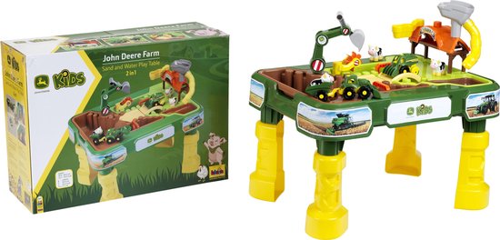 De John Deere boerderij speeltafel naast de verpakking, beide met afbeeldingen van tractoren en dieren.