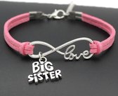 Armband met infinity teken en de tekst Love en een bedel met de tekst Big Sister roze
