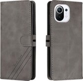 voor xiaomi mi 11 stiksels stijl 2-kleuren koe textuur horizontale flip pu lederen tas met houder en kaartsleuf en lanyard (grijs)