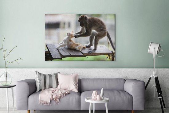 Toile de singe tirant les oreilles de chat 2cm 120x80 cm - Tirage photo sur toile (Décoration murale salon / chambre) / Peintures sur toile pour Animaux domestiques