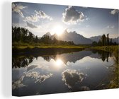 Canvas schilderij 140x90 cm - Wanddecoratie Ondergaande zon achter het Tetongebergte in Wyoming - Muurdecoratie woonkamer - Slaapkamer decoratie - Kamer accessoires - Schilderijen