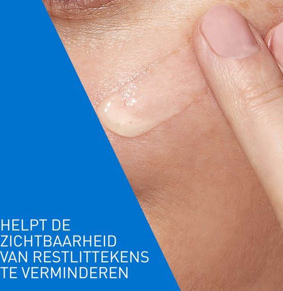 Close-up van een druppel serum op de huid. Tekst: Helpt de zichtbaarheid van restlittekens te verminderen.