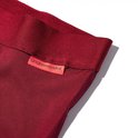 Detail van de rode tailleband met het 'undiemeister' label