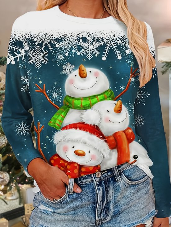 Donkerblauwe kersttrui met drie sneeuwpoppen met sjaals en kerstmutsen.