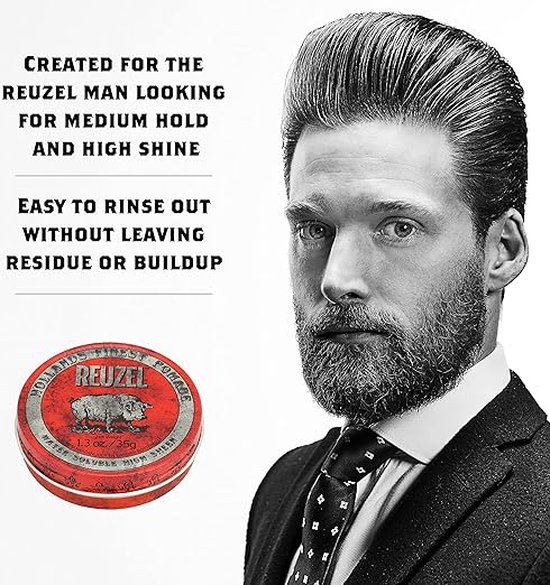 Man met een gestyled kapsel, baard en pak, naast een rood Reuzel pomadeblik.