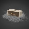 Crème Marshall speaker in grijze poeder met een uitbarstingseffect.