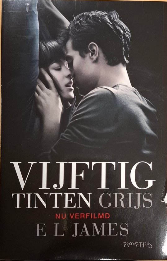 Boekomslag: een man en vrouw die elkaar omhelzen. Titel: Vijftig Tinten Grijs, NÚ VERFILMD, E L JAMES.