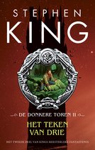 Boekomslag van Stephen King's "De Donkere Toren II - Het Teken van Drie". Centraal staat een medaillon met een afbeelding van Roland Dyin in een boslandschap, tegen een achtergrond van een kasteel en rode lucht.