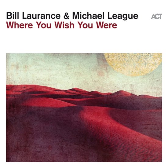 Albumhoes met rode woestijnduinen onder een abstracte gouden cirkel en tekst 'Bill Laurance & Michael League Where You Wish You Were'.