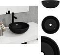 Lavabo noir en verre trempé, avec robinet noir.