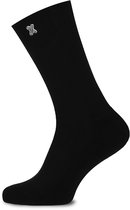 Zwarte sok met wit 'X' logo.