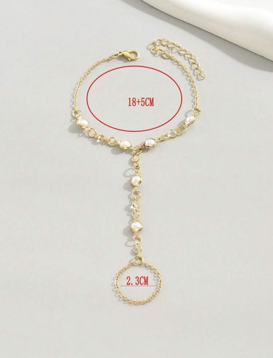 Gouden handketting met parels, steentjes en maatindicaties.