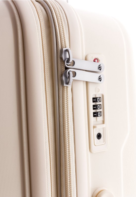 Close-up van de ritssluiting en het TSA-slot van de witte koffer.