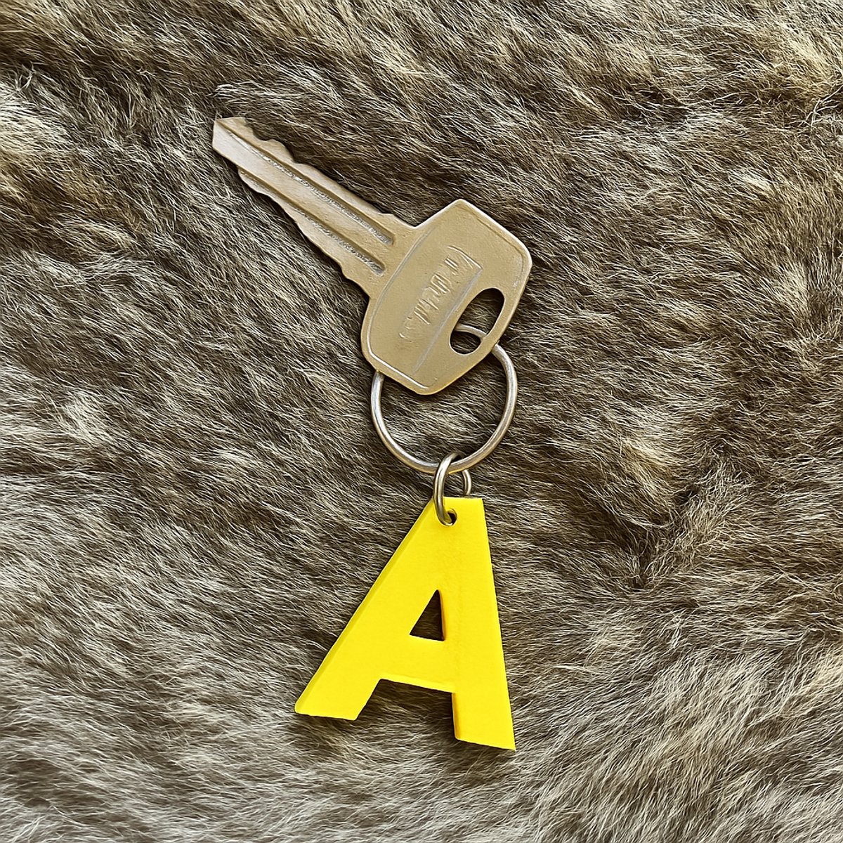 3D geprinte sleutelhanger - Letter U - Geel