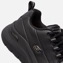Close-up van een zwarte sneaker met 'Arch Fit' tekst op de zijkant en zilveren details.